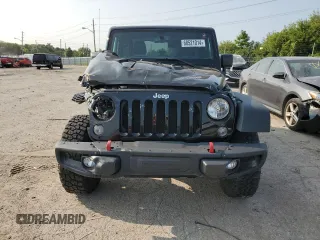 2015 Jeep Wrangler Rubicon Hard Rock z VIN 1C4BJWCG9FL714606, wystawiony jako Copart lot #68521014 z przebiegiem 35 187 mil mil oraz Szkoda całkowita • Salvage title. Historia ofert i sprzedaży dostępna na DreamBid. Obrazek 5.