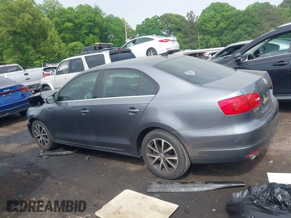 2014 Volkswagen Jetta SE z VIN 3VWD17AJ9EM298175, wystawiony jako IAAI lot #42084756 z przebiegiem 93 039 mil mil oraz . Historia ofert i sprzedaży dostępna na DreamBid. Obrazek 13.