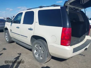 2014 GMC Yukon SLT with VIN 1GKS1CE01ER179379, listed as a IAAI auction lot 41717271 with 136,999 mi miles. Bid and sale history available at carsss.com. Image 3.