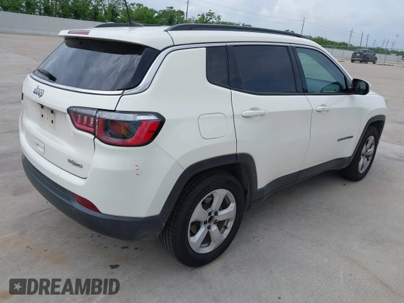 2019 Jeep Compass Latitude with VIN 3C4NJCBB9KT652088, listed as a IAAI auction lot 42162439 with 97,276 mi miles and . Bid and sale history available at DreamBid. Image 4.