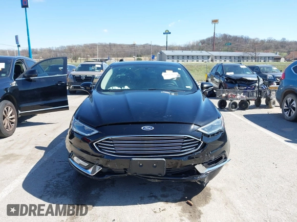 2017 Ford Fusion SE z VIN 3FA6P0HD1HR138693, wystawiony jako IAAI lot #41837634 z przebiegiem 117 638 mil mil oraz . Historia ofert i sprzedaży dostępna na DreamBid. Obrazek 12.
