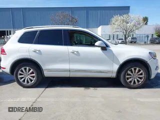 2012 Volkswagen Touareg Sport with VIN WVGEF9BP5CD007294, listed as a IAAI auction lot 41841268 with 160,883 mi miles and . Bid and sale history available at DreamBid. Image 13.