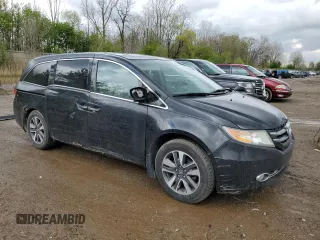 2014 Honda Odyssey Touring z VIN 5FNRL5H97EB508649, wystawiony jako Copart lot #55665245 z przebiegiem 162 892 mil mil oraz Czysty tytuł • Clean title. Historia ofert i sprzedaży dostępna na DreamBid. Obrazek 4.