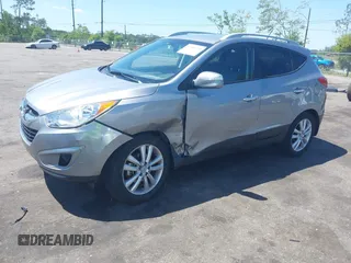 2013 Hyundai Tucson GLS with VIN KM8JU3AC4DU588062, listed as a IAAI auction lot 42080348 with 76,937 mi miles. Bid and sale history available at carsss.com. Image 17.