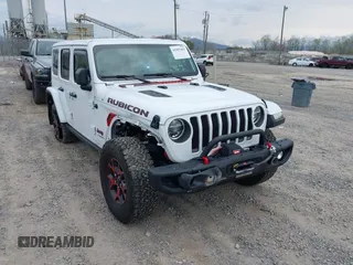 2021 Jeep Wrangler Unlimited Rubicon with VIN 1C4HJXFG1MW577829, listed as a IAAI auction lot 41997002 with 26,443 mi miles and . Bid and sale history available at DreamBid. Image 1.