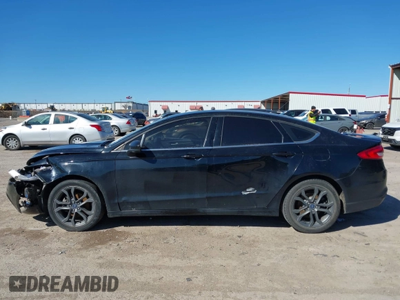 2018 Ford Fusion SE z VIN 3FA6P0H77JR180057, wystawiony jako IAAI lot #41729451 z przebiegiem 122 200 mil mil oraz . Historia ofert i sprzedaży dostępna na DreamBid. Obrazek 14.