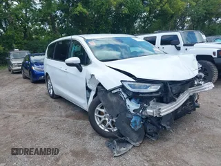 2023 Chrysler Pacifica Touring L with VIN 2C4RC1BG5PR559686, listed as a IAAI auction lot 42759588 with 55,464 mi miles and . Bid and sale history available at DreamBid. Image 1.