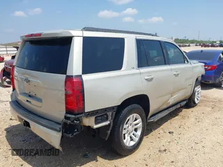 2015 Chevrolet Tahoe LS with VIN 1GNSCAKC9FR294832, listed as a IAAI auction lot 39274877 with 126,932 mi miles and . Bid and sale history available at DreamBid. Image 4.