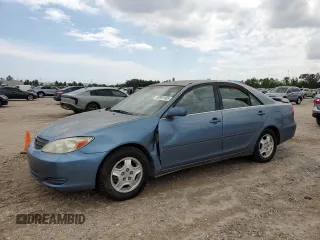 2002 Toyota Camry XLE z VIN 4T1BF32K12U515023, wystawiony jako Copart lot #53891485 z przebiegiem 229 543 mil mil oraz Czysty tytuł • Clean title. Historia ofert i sprzedaży dostępna na DreamBid. Obrazek 1.