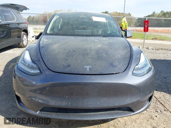 2022 Tesla Model Y Long Range z VIN 7SAYGDEE7NA006476, wystawiony jako IAAI lot #41894606 z przebiegiem 63 380 mil mil oraz . Historia ofert i sprzedaży dostępna na DreamBid. Obrazek 12.