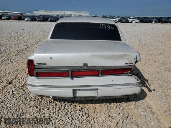 1997 Lincoln Town Car Signature z VIN 1LNLM82W9VY681894, wystawiony jako Copart lot #71467034 z przebiegiem 129 142 mil mil oraz Szkody całkowita. Historia ofert i sprzedaży dostępna na DreamBid. Obrazek 6.