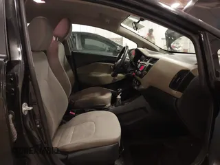 2014 Kia Rio LX with VIN KNADM4A32E6409785, listed as a IAAI auction lot 41810262 with 183,669 mi miles. Bid and sale history available at carsss.com. Image 5.