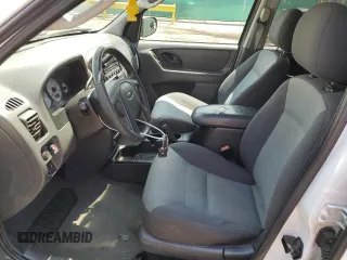 2004 Ford Escape XLS with VIN 1FMCU92114DA15564, listed as a Copart auction lot 59358015 with 186,135 mi miles and Salvage title. Bid and sale history available at DreamBid. Image 7.