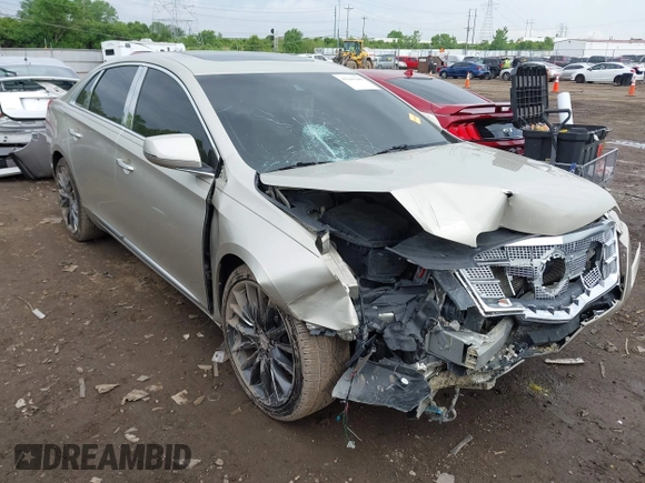 2014 Cadillac XTS Platinum z VIN 2G61T5S31E9209179, wystawiony jako IAAI lot #42241440 z przebiegiem 79 651 mil mil oraz . Historia ofert i sprzedaży dostępna na DreamBid. Obrazek 1.