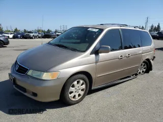 2004 Honda Odyssey EX-RES with VIN 5FNRL18894B107327, listed as a Copart auction lot 61669715 with 165,363 mi miles and Salvage title. Bid and sale history available at DreamBid. Image 1.