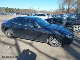 2014 Maserati Ghibli S Q4 with VIN ZAM57RTA1E1091738, listed as a IAAI auction lot 41518359 with 75,641 mi miles. Bid and sale history available at carsss.com. Image 13.