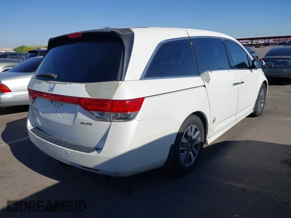 2014 Honda Odyssey Touring with VIN 5FNRL5H97EB037361, listed as a IAAI auction lot 42106742 with 198,279 mi miles and . Bid and sale history available at DreamBid. Image 4.