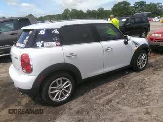 2015 MINI Countryman z VIN WMWZB3C52FWR46114, wystawiony jako IAAI lot #42107741 z przebiegiem 110 022 mil mil oraz . Historia ofert i sprzedaży dostępna na DreamBid. Obrazek 4.