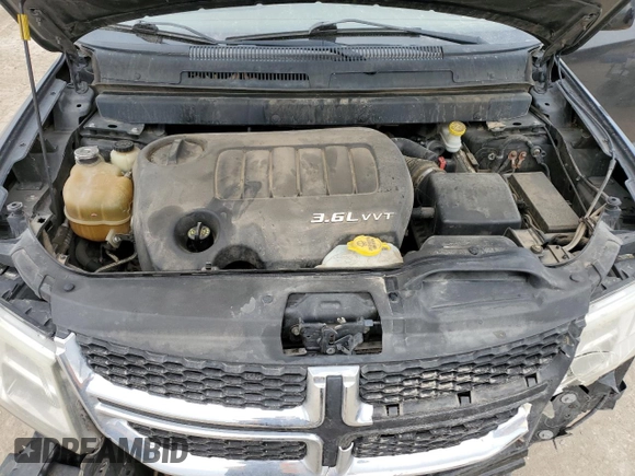 2012 Dodge Journey SXT z VIN 3C4PDCBG2CT314562, wystawiony jako Copart lot #57500195 z przebiegiem 156 319 mil mil oraz Szkoda całkowita • Salvage title. Historia ofert i sprzedaży dostępna na DreamBid. Obrazek 12.