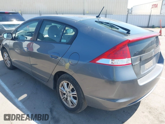 2010 Honda Insight EX with VIN JHMZE2H72AS015870, listed as a IAAI auction lot 42762384 with 58,121 mi miles and . Bid and sale history available at DreamBid. Image 3.
