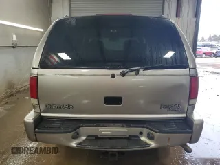 2001 Oldsmobile Bravada z VIN 1GHDT13W212196750, wystawiony jako Copart lot #44019065 z przebiegiem 126 878 mil mil oraz Szkody całkowita. Historia ofert i sprzedaży dostępna na DreamBid. Obrazek 6.