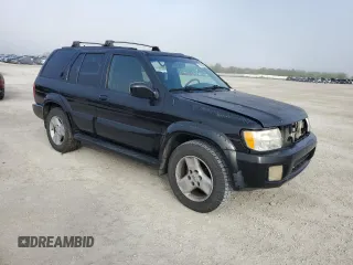 2001 Infiniti QX4 with VIN JNRDR09X21W204207, listed as a Copart auction lot 79935604 with Not Provided miles and Salvage Title. Bid and sale history available at DreamBid. Image 4.