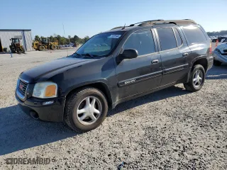 2005 GMC Envoy XL SLT with VIN 1GKET16S256109757, listed as a Copart auction lot 77220144 with 246,444 mi miles and Salvage Title. Bid and sale history available at carsss.com. Image 1.