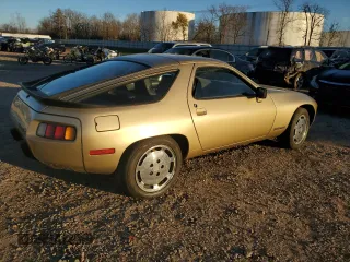 1984 Porsche 928 z VIN WP0JB092XES862382, wystawiony jako Copart lot #79716354 z przebiegiem 117 599 mil mil oraz Szkody całkowita. Historia ofert i sprzedaży dostępna na DreamBid. Obrazek 3.