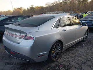 2017 Lincoln MKZ Premiere with VIN 3LN6L5A90HR631642, listed as a IAAI auction lot 41818680 with 56,773 mi miles and . Bid and sale history available at DreamBid. Image 4.
