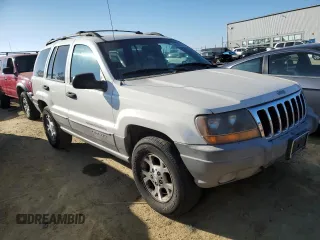 1999 Jeep Grand Cherokee Laredo z VIN 1J4GW58N8XC736438, wystawiony jako Copart lot #88605625 z przebiegiem 181 612 mil mil oraz Czysty tytuł • Clean title. Historia ofert i sprzedaży dostępna na DreamBid. Obrazek 4.