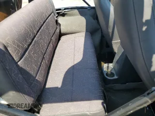 2002 Jeep Wrangler Sport with VIN 1J4FA49S02P721457, listed as a Copart auction lot 61726855 with 76,191 mi miles and Salvage title. Bid and sale history available at DreamBid. Image 11.