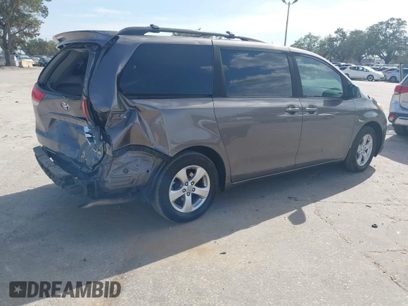 2014 Toyota Sienna LE AAS with VIN 5TDKK3DCXES432611, listed as a IAAI auction lot 40771635 with 214,145 mi miles and . Bid and sale history available at carsss.com. Image 4.