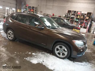 2013 BMW X1 28i with VIN WBAVM1C59DVW42455, listed as a IAAI auction lot 41627137 with 170,120 mi miles. Bid and sale history available at carsss.com. Image 1.