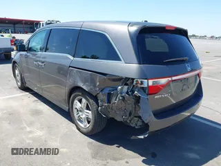 2012 Honda Odyssey Touring with VIN 5FNRL5H98CB011297, listed as a IAAI auction lot 42207061 with 154,073 mi miles and . Bid and sale history available at DreamBid. Image 3.