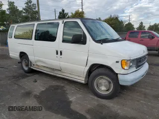 1999 Ford Econoline Passenger XL with VIN 1FBSS31L2XHA95612, listed as a Copart auction lot 72615104 with 211,283 mi miles and Salvage Title. Bid and sale history available at DreamBid. Image 4.