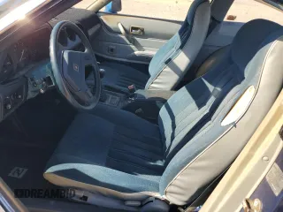 1979 Datsun 280ZX z VIN HS130133365, wystawiony jako Copart lot #77113584 z przebiegiem 99 721 mil mil oraz Szkody całkowita. Historia ofert i sprzedaży dostępna na DreamBid. Obrazek 7.