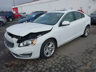 2015 Volvo S60 T5 Drive-E Premier with VIN YV126MFK4F2349564, listed as a IAAI auction lot 41711836 with 59,897 mi miles. Bid and sale history available at carsss.com. Image 2.