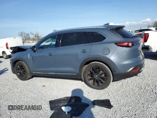 2021 Mazda CX-9 Grand Touring with VIN JM3TCADY1M0517525, listed as a Copart auction lot 43868965 with 123,602 mi miles and Salvage title. Bid and sale history available at DreamBid. Image 2.