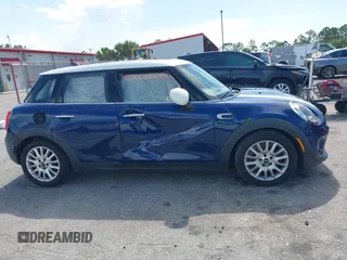 2015 MINI Hardtop 4 Door with VIN WMWXS5C51FT827510, listed as a IAAI auction lot 42365599 with 53,667 mi miles and . Bid and sale history available at DreamBid. Image 13.