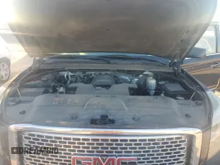 2015 GMC Yukon Denali with VIN 1GKS1CKJ7FR132677, listed as a Copart auction lot 82118584 with 144,798 mi miles and Salvage Title. Bid and sale history available at carsss.com. Image 12.