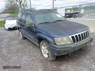 2003 Jeep Grand Cherokee Laredo with VIN 1J4GW48S63C591605, listed as a IAAI auction lot 41973681 with 177,024 mi miles. Bid and sale history available at carsss.com. Image 1.