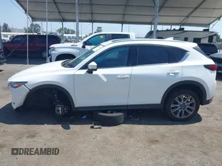 2020 Mazda CX-5 Grand Touring with VIN JM3KFADM9L0821930, listed as a IAAI auction lot 42549986 with 29,929 mi miles and . Bid and sale history available at DreamBid. Image 14.