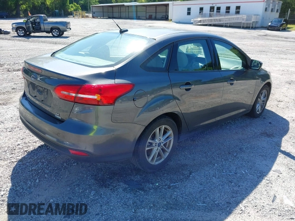 2018 Ford Focus SE z VIN 1FADP3FE1JL238012, wystawiony jako IAAI lot #42185232 z przebiegiem 143 687 mil mil oraz . Historia ofert i sprzedaży dostępna na DreamBid. Obrazek 4.