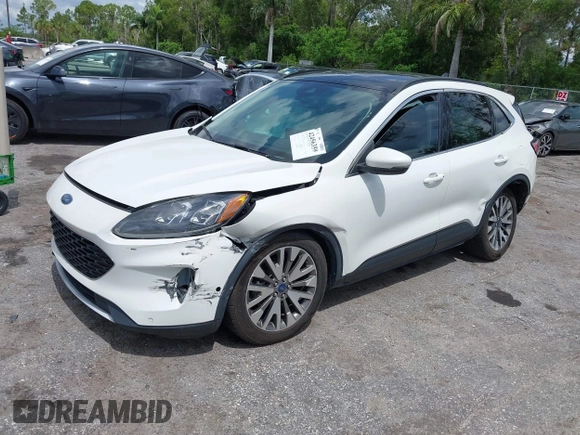 2020 Ford Escape Titanium Hybrid with VIN 1FMCU0DZ3LUC07842, listed as a IAAI auction lot 42456359 with 62,756 mi miles and . Bid and sale history available at DreamBid. Image 18.
