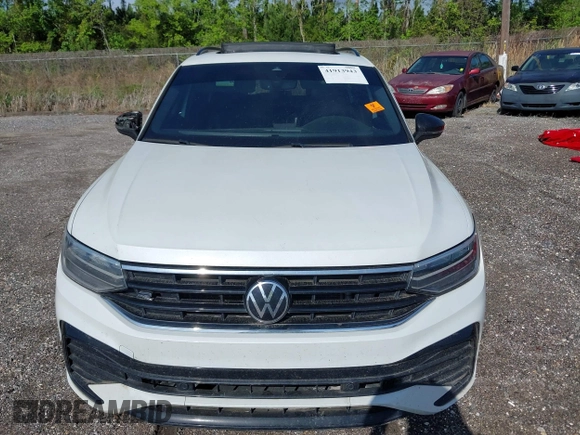 2023 Volkswagen Tiguan SE R-Line Black with VIN 3VVCB7AX9PM042025, listed as a IAAI auction lot 41913943 with 114,097 mi miles and . Bid and sale history available at DreamBid. Image 6.