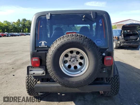 2001 Jeep Wrangler Sport with VIN 1J4FA49S21P339042, listed as a Copart auction lot 56922555 with 113,315 mi miles and Salvage title. Bid and sale history available at DreamBid. Image 6.