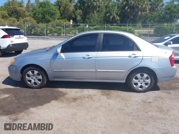 2005 Kia Spectra LX with VIN KNAFE121955107403, listed as a IAAI auction lot 42055036 with 157,605 mi miles. Bid and sale history available at carsss.com. Image 14.