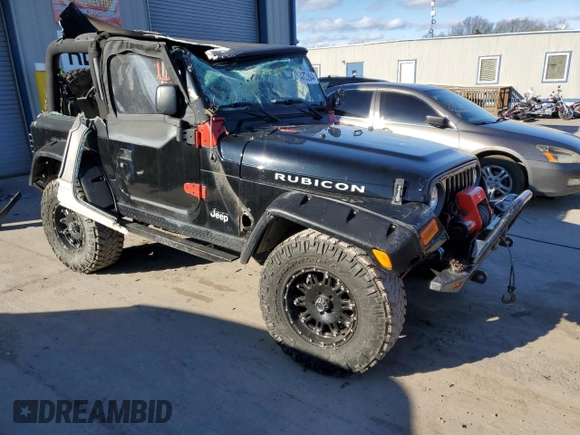 2004 Jeep Wrangler Rubicon with VIN 1J4FA69S74P785297, listed as a Copart auction lot 47332944 with 61,323 mi miles and Salvage Title. Bid and sale history available at carsss.com. Image 4.