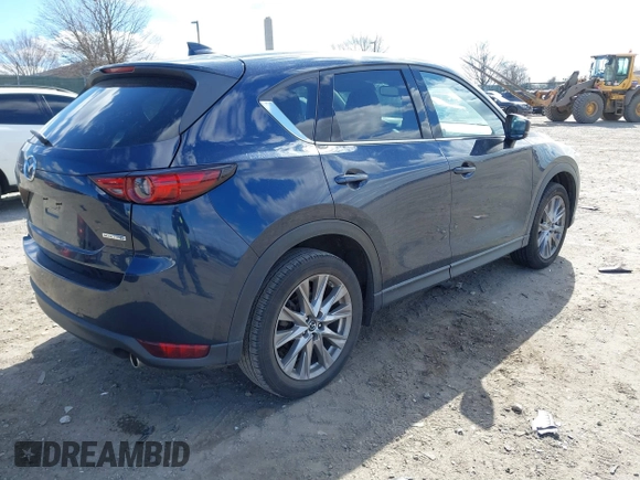2020 Mazda CX-5 Grand Touring with VIN JM3KFBDM2L0768770, listed as a IAAI auction lot 41695058 with 44,192 mi miles. Bid and sale history available at carsss.com. Image 4.