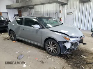 2014 Scion tC z VIN JTKJF5C71E3071683, wystawiony jako Copart lot #50971055 z przebiegiem Nie podano mil oraz Nie do naprawy • Non repairable. Historia ofert i sprzedaży dostępna na DreamBid. Obrazek 4.